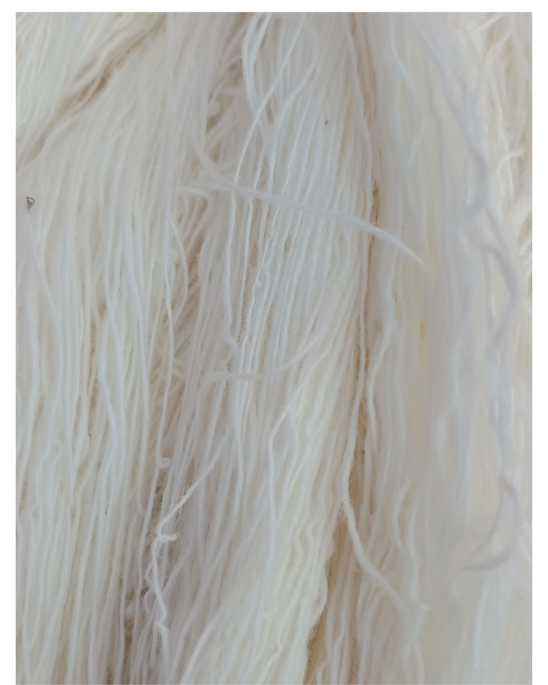 Artisan weaving a hand-knotted rug on a loom